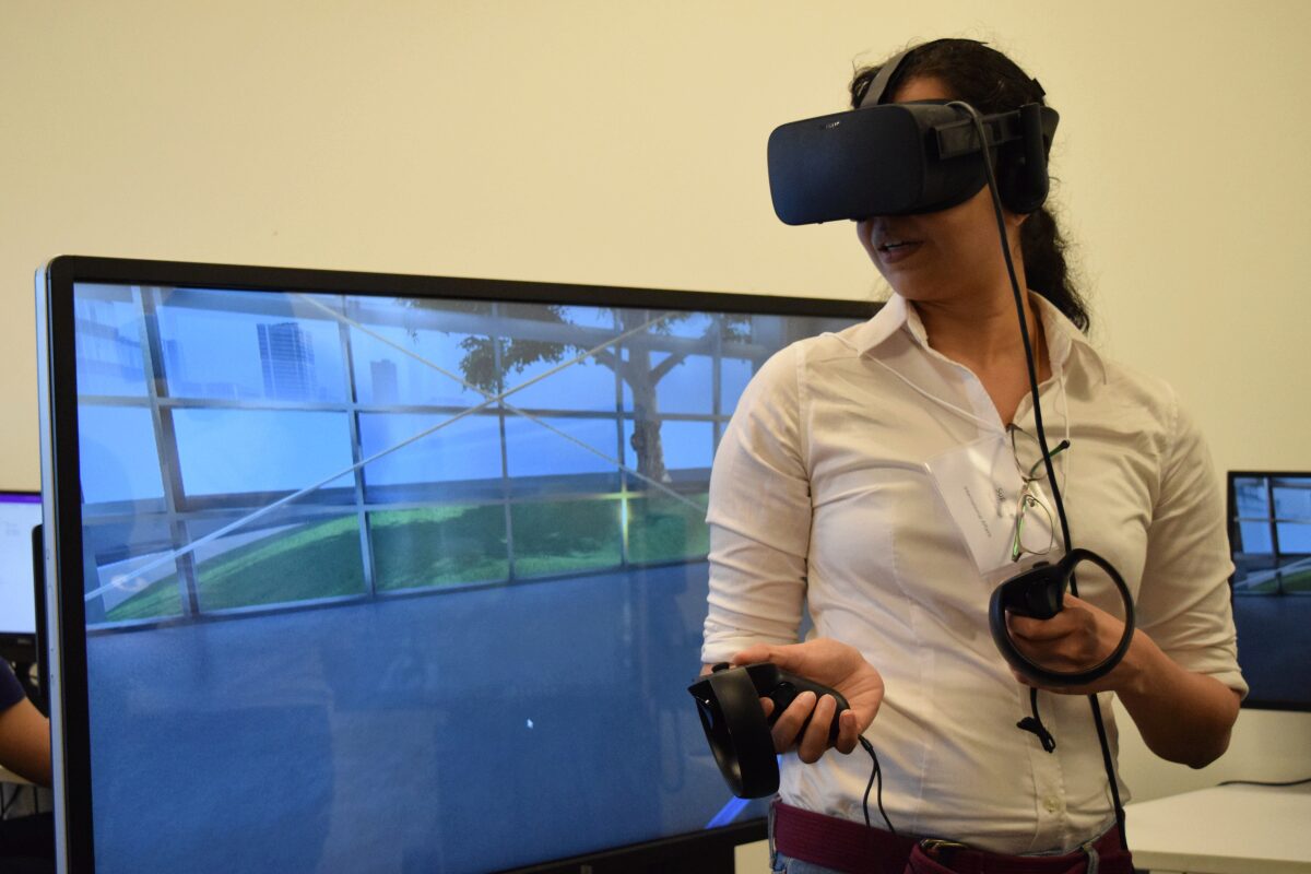 Woman with interactive goggles in front of testing screen